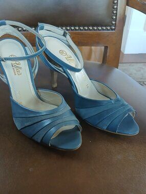 Strapped leather heels in 2 tone mid blue colors.